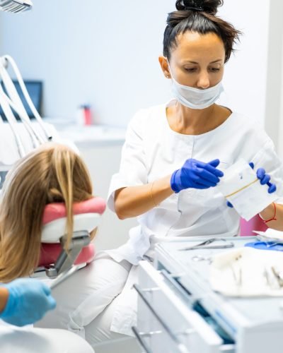 dentist in the process. Dental services, dental office, dental treatment.